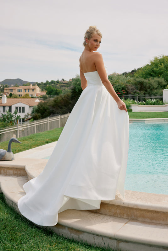 Satin sleeveless ball gown with high slit